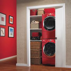 a red washer and dryer in a room