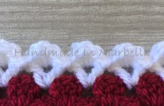 four crocheted pieces of red and white yarn