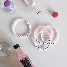 the contents of a personal care kit including bracelets, bottles and other items on a table