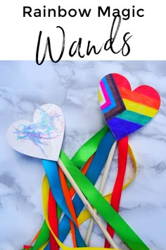 rainbow magic wands on a marble surface with text overlay reading rainbow magic wands