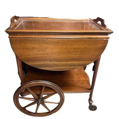 an old fashioned wooden cart with wheels