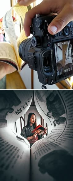 a person holding a camera in front of an open book