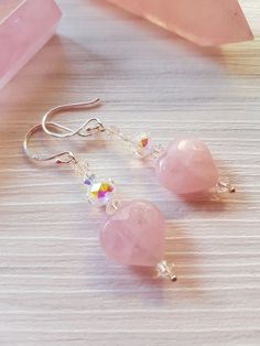 Elegant faceted pretty pink Rose Quartz gemstone heart earrings, dangle drop style featuring beautiful sparkling Swarovski Crystal beads in Clear AB. I have lovingly made these pretty earrings and have used 925 Sterling silver ear wires and sterling silver wire posts, the drop is approximately 4cm, these are pretty eye catching earrings, which you I know you will love  I recently had the honor to made five sets of these beautiful earrings for the lovely bridesmaids at a wedding and they looked a Pink Heart Beads Sterling Silver Earrings, Pink Sterling Silver Heart Bead Earrings, Pink Sterling Silver Heart Beaded Earrings, Pink Heart Crystal Earrings For Valentine's Day, Pink Crystal Earrings For Valentine's Day, Pink Heart-shaped Crystal Earrings For Valentine's Day, Pink Sterling Silver Heart Dangle Earrings, Quartz Gemstones, Pink Rose Quartz