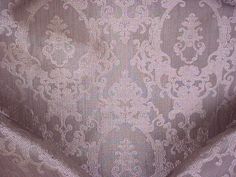 an upholstered fabric with white flowers on it