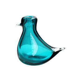 a blue glass vase sitting on top of a table