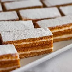 several pieces of cake sitting on top of a white plate