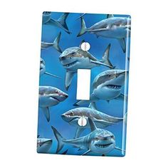 a light switch cover with sharks on it