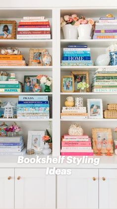 a white bookcase filled with lots of books