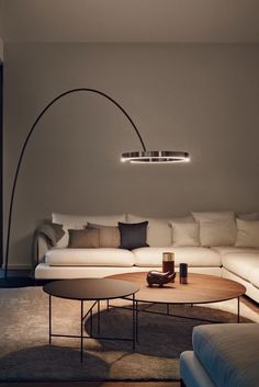 A round wooden table with three hanging round lamps on top Arc Floor Lamps Living Room, Standing Lamp Living Room, Stand Light, Arc Floor Lamps, Led Floor Lamp, Standing Lamp, Sofa Home, Adjustable Lighting