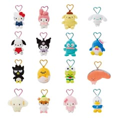 a bunch of small stuffed animals hanging from strings in the shape of heart shaped objects