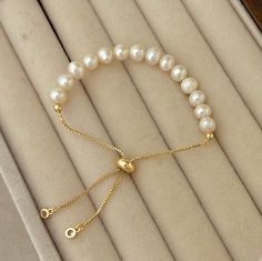 This bracelet is a must-have for your bracelet stack, it is simple for daily wear also would be great for matching your pretty dresses! Great for all occasions. This style is also a great gift for a friend or loved one. 🤍Material🤍 5-6 mm Freshwater Pearls 18K Gold Filled Adjustable bracelet 💛Great For All Occasions  💛Freshwater Pearls 💛18K Gold Filled 💛Hypoallergenic  💛Tarnish Free 💛Gift For Her 💛Birthday Gift 💛Christmas Gift 💛Free Domestic Shipping  🤍 Freshwater Pearl 🤍  The unique features of freshwater pearls, from their origin in freshwater sources to the variety of colors and affordability, make them a standout and accessible choice for stylish and creative jewelry designs🌟 🤍 Packaging 🤍 If you purchase for your loved ones, and wanted to make it look like a nice gift, Minimalist Pearl Bangle Bracelet Gift, Minimalist Adjustable Bracelet As Gift For Her, Elegant Beaded Bracelets With Sliding Knot, Elegant Beaded Bracelets With Sliding Knot For Gifts, Adjustable Dainty Pearl Bracelet, Adjustable Classic Pearl Bracelet For Everyday, Classic Adjustable Pearl Bracelet, Delicate Adjustable Bracelets For Gifts, Delicate Adjustable Bracelets As Gift