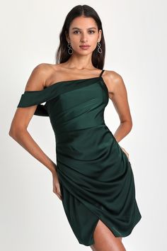 You're sure to cast some love spells while you're strutting in the Lulus Magnificent Magic Emerald Green Satin Asymmetrical Mini Dress! Luxe woven satin shapes this event-ready dress that has an eye-catching asymmetrical neckline (kept in place by hidden no-slip strips) with a single adjustable strap and a folded-over, off-the-shoulder strap. Gathering accents the bodice and waist atop an overlapping tulip mini skirt, perfect for showing off your favorite strappy heels. Hidden side zipper/clasp. Mini Dress Satin, Green Homecoming Dresses, Lulu Fashion, Tulip Dress, Adhesive Bra, Asymmetrical Neckline, To Cast, Green Satin, Love Spells