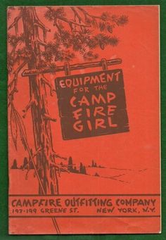 an old camp fire brochure is on the green cover with red lettering and trees