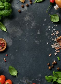 an assortment of vegetables and spices on a black background with space for text or image