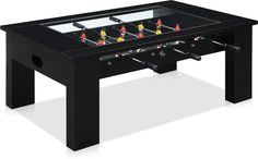 a foosball table is shown in black and has three people playing soccer on it