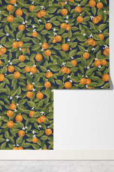 an orange print wallpaper with green leaves and white flowers on a dark blue background