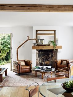 a living room filled with furniture and a fire place