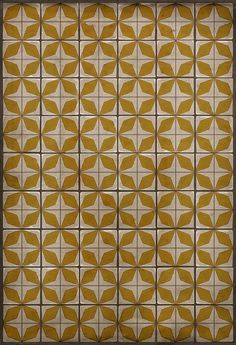 an old fashioned tile pattern in gold and white