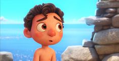 a cartoon boy sitting on top of a pile of rocks next to the ocean with his eyes wide open