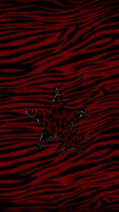 a red and black zebra print with a star on it