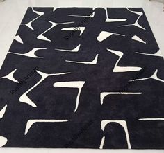 a black rug with white letters on it