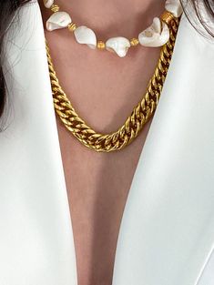 Gold gourmet chain necklace made of steel. This is a statement necklace suitable for a minimalist look or as a base necklace for layering. Dimensions: 50 cm / 20in You can add an extender chain of 5cm / 2in (Choose in the dropdown menu) Nickel Free DELIVERY (estimate delays) Greece: 2-5 business days via ELTA Europe: 5-10 business days via Hellenic Post International: 10-21 business days via Hellenic Post You can shorten considerably your delivery times by upgrading to DHL Express services at checkout. All Pure Greek Jewelry are inspired from the current trends, classical arts, world traditions and cultures. Our jewelry are handmade with love and imagination so you can enjoy unique creations. We use mineral and semi-precious stones, freshwater pearls, crystals, steel chains and gold plated Chunky Chain Link Stainless Steel Necklace, Stainless Steel Chunky Chain Link Necklace, Minimalist Metal Pearl Chain Necklace, Everyday White Chunky Chain Necklace, Minimalist Metal Chain Necklace With Pearl, White Chunky Chain Necklace For Everyday, Chunky Chain White Necklace For Everyday Wear, Metal Pearl Chain Link Necklace, White Cuban Link Chain Necklace With Adjustable Chain