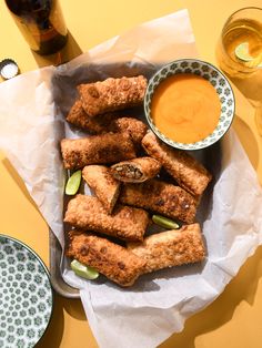 some fried food is on a plate with dipping sauce