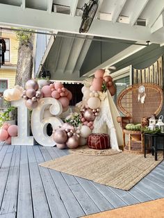 balloons and decorations are displayed on the porch