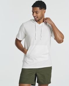 Seasonal Essential: Our Real Essentials Men's Cotton Short-Sleeve Hoodie is a must-have for warmer weather, providing lightweight coverage and style for spring and summer activities.Summer Staple: Beat the heat in style with our hoodie's breathable fabric and short sleeves, perfect for outdoor workouts, beach days, or casual outings under the sun.Warm Weather Comfort: Stay cool and comfortable all season long with our hoodie's airy design and moisture-wicking properties, ensuring you stay dry an Casual Hoodie With Stretch And Kangaroo Pocket, Casual Stretch Hoodie With Kangaroo Pocket, Stretch Hoodie With Drawstring, Stretch Drawstring Hoodie Tops, White Relaxed Fit Top With Drawstring, Cotton Tops With Kangaroo Pocket For Loungewear, Athleisure Tops With Drawstring Hood For Leisure, Casual Cotton Hooded T-shirt, Leisure Hoodie With Drawstring Hood