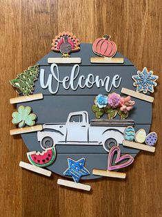 a sign that says welcome with some magnets on it