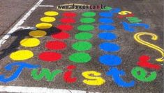 a parking lot with colorful chalk writing on it