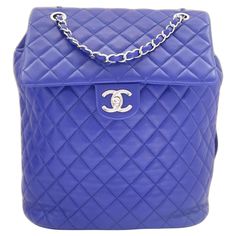 Super cool Chanel Urban Spirit backpack - worn once and comes with authenticity card and dustbag. Made from bright blue lamb leather with signature diamond quilting, it has silvertone CC turn lock flap and chain link top handle and two leather shoulder straps with embossed buckles to adjust. Has cotton twill lining. Measures approx - 10” x 11” x 5.5”. Mochila Chanel, Chanel Backpack, Blue Backpack, Vintage Chanel, Backpack Purse, Coco Chanel, Super Cool, Bright Blue, Fashion Handbags