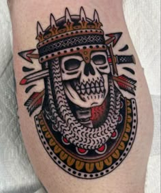 a skull with a crown on it's head is shown in this tattoo design