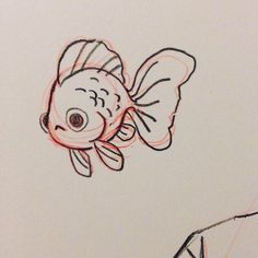 a drawing of a goldfish on a piece of paper