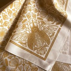 "This is a one-color, hand screen printed cotton bandana. This color way is called 'Saffron,' it's a natural colored bandana and the design is printed in a yellow ochre ink. The Lotus & Beetle design is one of my original illustrations. The bandana measures approximately 22\" x 22.\" The design is printed on one side. It's 100% cotton, printed with non-toxic, water-based inks. ----------------------------------------------------- CARE These bandanas are made of 100% cotton, and are light weight Scarf Design Ideas Illustration, Cool Bandanas Designs, Bandana Design Pattern, Bandana Print Pattern, Bandana Inspiration, Bandana Aesthetic, Bandana Designs, Beetle Design, Tarot Altar