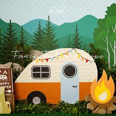 a camper is parked in front of a forest with trees and mountains behind it