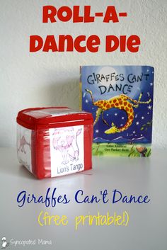 a red box with a giraffes can't dance on it next to a book