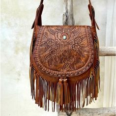 Hand Tooled Real Leather Bag Made In Boli. Bohemian Crossbody Bag With Leather Lining, Bohemian Leather Saddle Bag With Leather Handles, Bohemian Hand Tooled Saddle Bag, Hand Tooled Leather Crossbody Bag, Hand-tooled Saddle Bags, Bohemian Leather Saddle Bag, Bohemian Leather Crossbody Bag, Bohemian Leather Saddle Bag Satchel, Bohemian Leather Saddle Satchel Bag