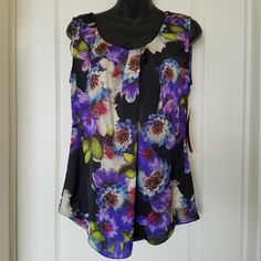 Beautiful Flowy Floral Fabric. Nwt. One Tiny Flaw On The Shoulder: Fabric Is Scuffed On The Edge. See Last Pic. Great For Spring. Career Or Casual. 19" Pit To Pit. 25" Shoulder To Hem In Front And 28" Shoulder To Hem In Back. Purple Tank Top For Spring, Purple Sleeveless Tops, Elegant Multicolor Sleeveless Blouse, Purple Sleeveless Blouse For Spring, Purple Sleeveless Blouse Tank Top For Summer, Spring Purple Tank Top, Elegant Purple Tank Top, Multicolor Floral Print Tank Blouse, Casual Purple Sleeveless Blouse