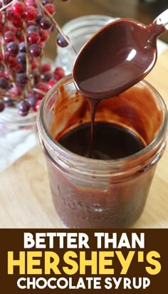 chocolate sauce being poured into a jar with the words, better than hershey's chocolate syrup