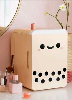 a white box sitting on top of a counter next to a mirror