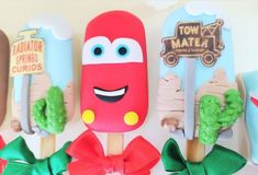 popsicles decorated like cars and trees with bows