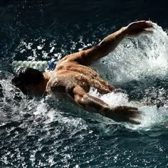 a man swimming in the water with a quote about swimming is a sport everything else is just a game