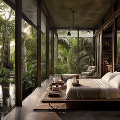 a bed sitting on top of a wooden floor next to a lush green forest