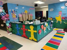 an ice cream shop decorated with candy and decorations on the front desk for children's birthdays