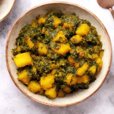 a bowl filled with green and yellow food