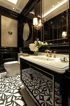 a bathroom with black and white tile flooring