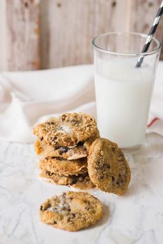 chocolate chip cookies and milk on a table