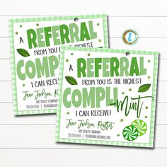 two refer cards with green leaves on them