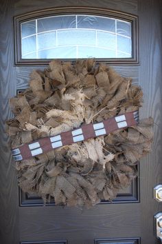 a star wars wreath is hanging on the front door